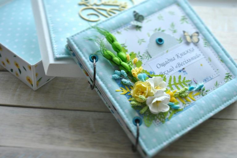 Beautiful handmade scrapbook with floral decorations, perfect for capturing wedding memories.